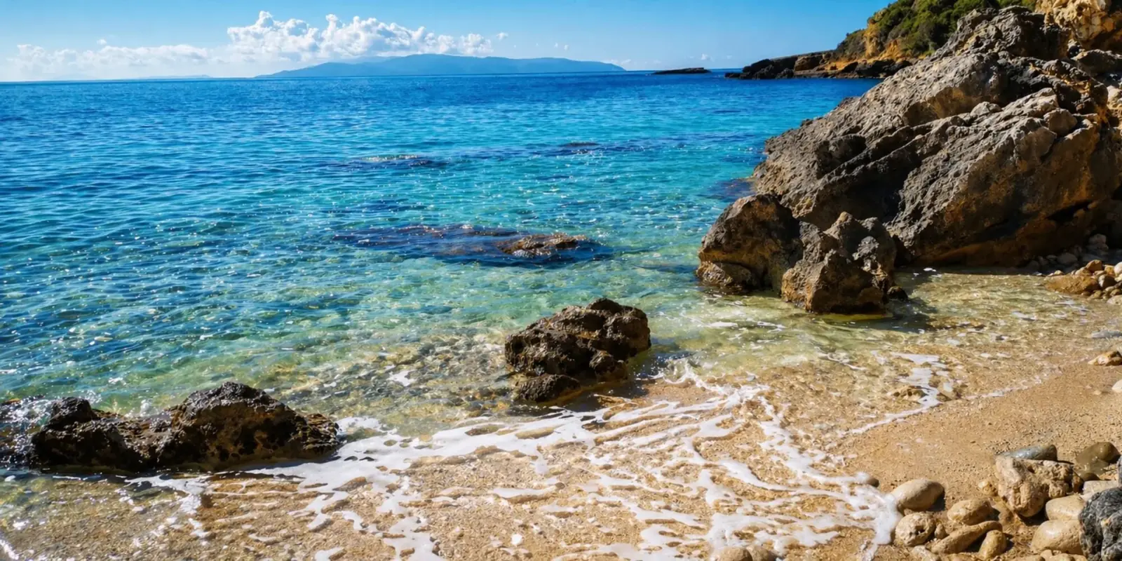 Quiet sandy beach 450 m from Villa Aquarius in Pessada, Kefalonia